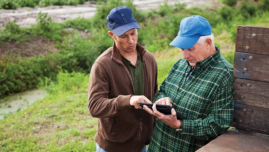 farmers using digital tablet