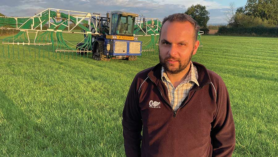 Matthew Targett in field with Agrometer umbilical slurry application