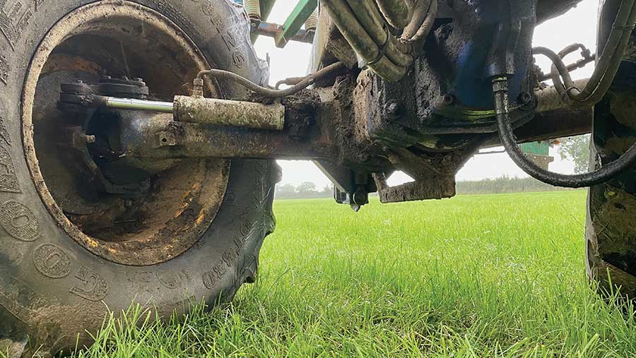 Rear steering on umbilical slurry applicator