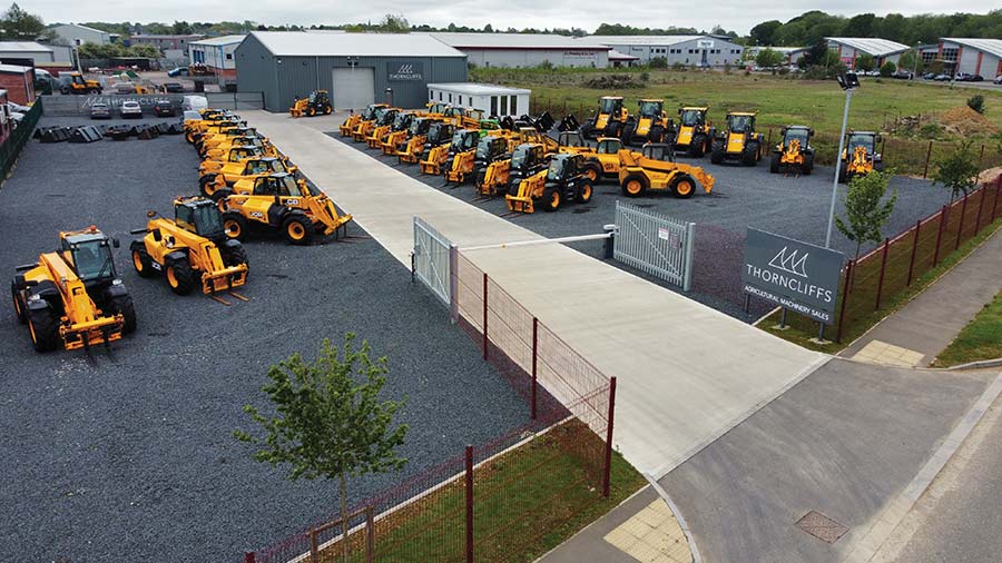 Rows of telehandlers in a yard