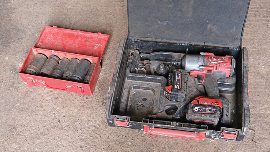 Power tool and parts in a plastic case
