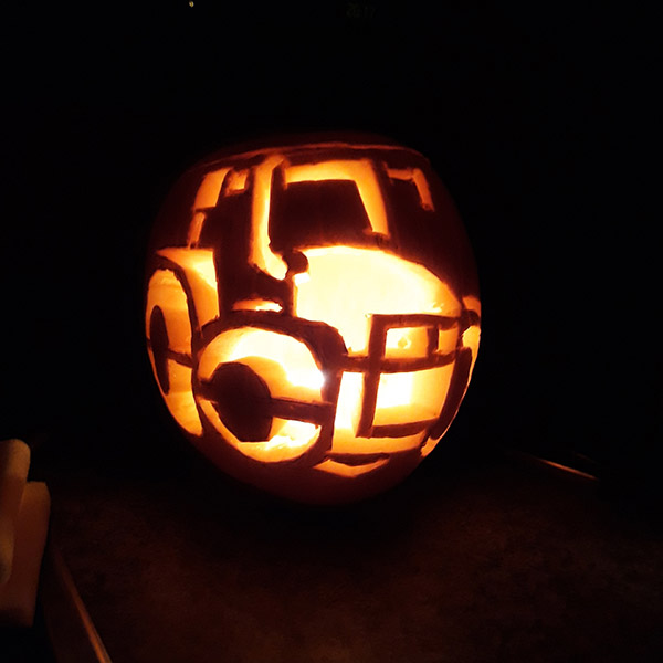 Tractor carved into pumpkin