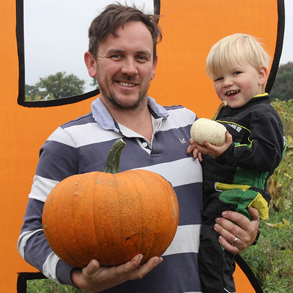Rupert Thornicroft holding a pumpkin and baby Boo