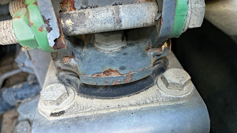 Close-up of rusted mounting on tractor