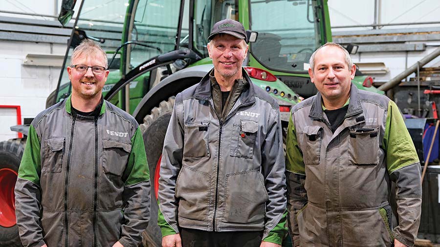 Three men (John Saxton, Richard Pykett and Sam Vincent) in front of a tractor