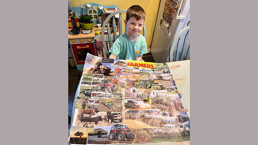 Young boy sits at a table with a collage of Farmers Weekly pages