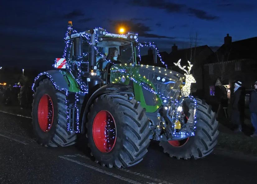 Tractor lit with Christmas lights