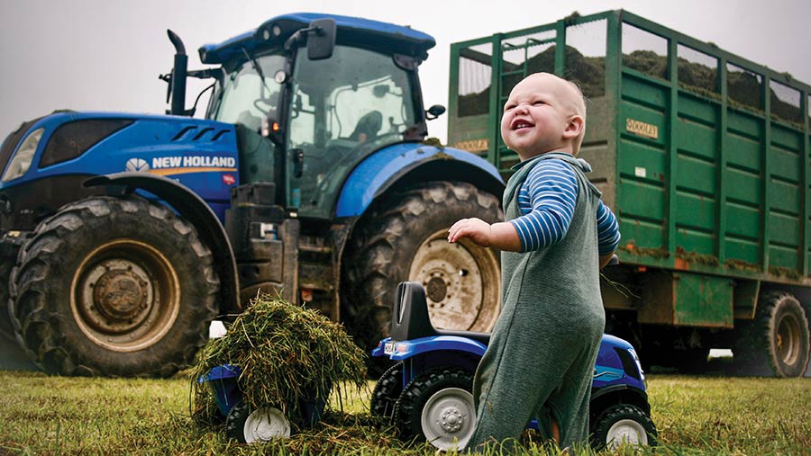 Young toddler (Archie) with toy tractor