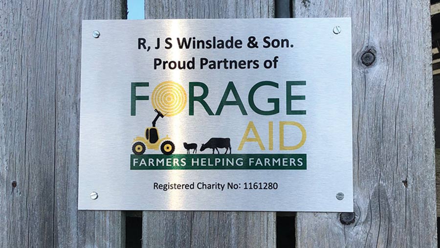 Forage Aid sign on fence