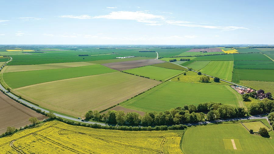 Aerial view of fields and farm house