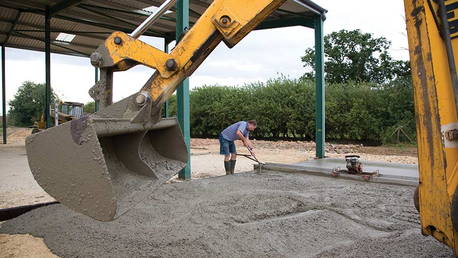 workmen laying concrete