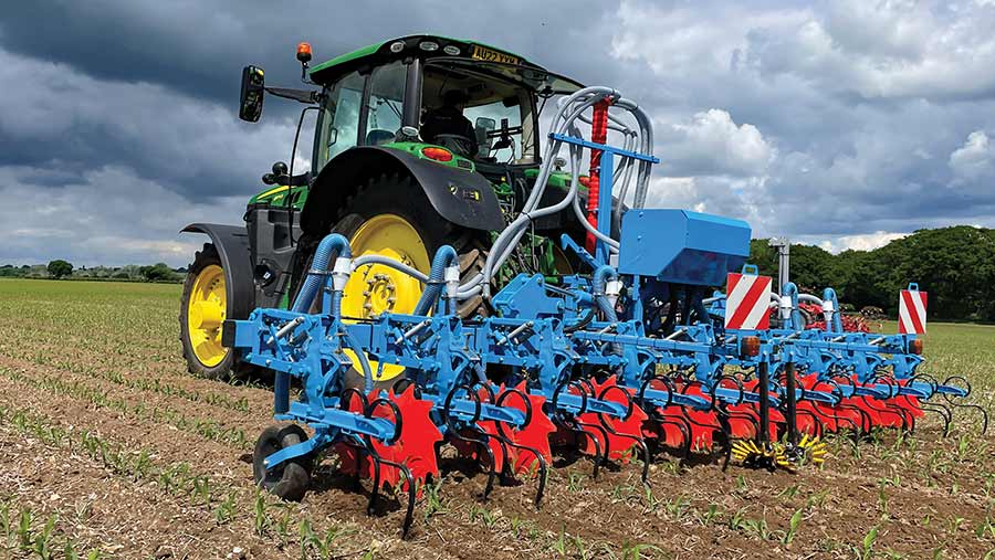 Tractor pulling a seed drill