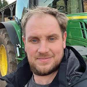 Rob Atkin in front of a tractor