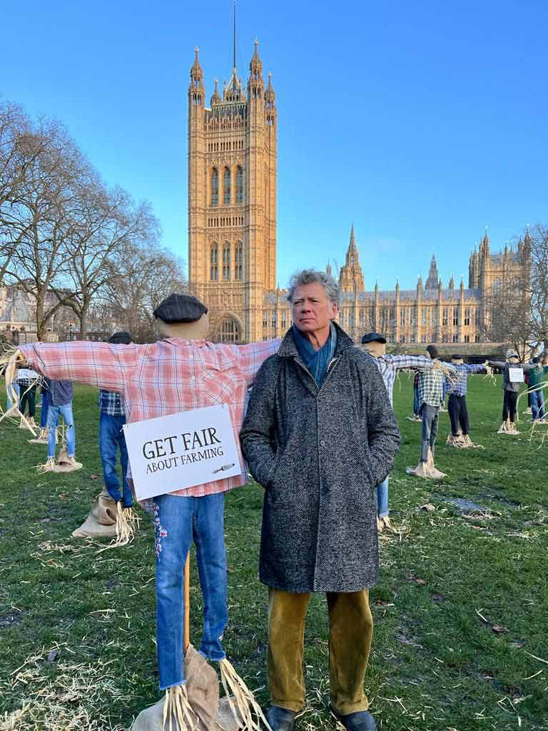 Guy Singh Watson with scarecrow