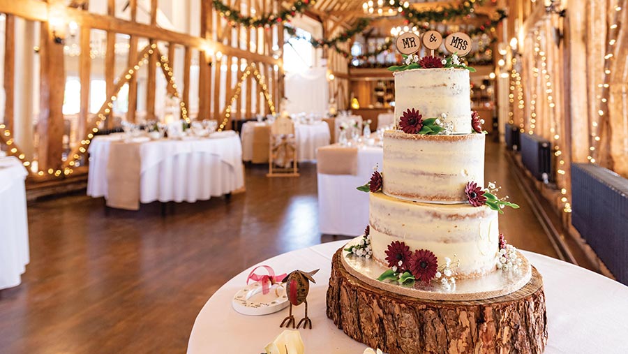 Wedding cake inside a barn