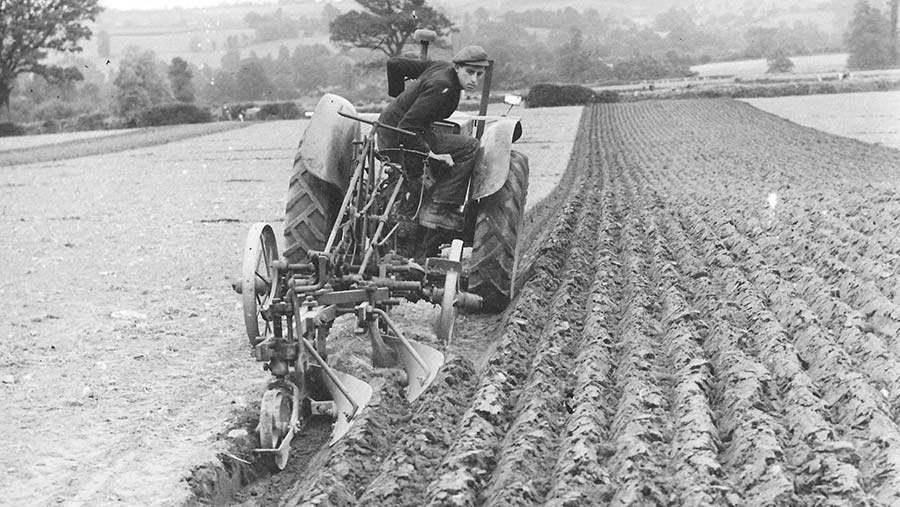 Ivan Goff sitting on a plough