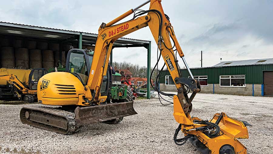 JCB 8080 digger with hedgecutter head