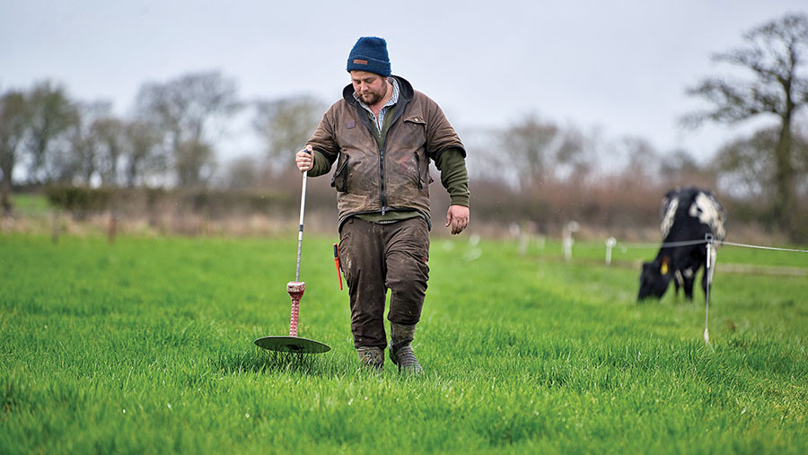 Farmer using a plate meter