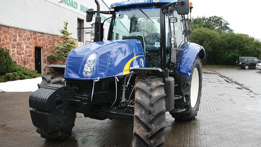 Tractor with a bonnet protector fitted