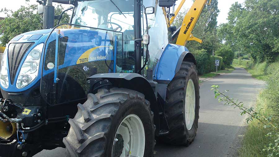 Tractor with protective window guards