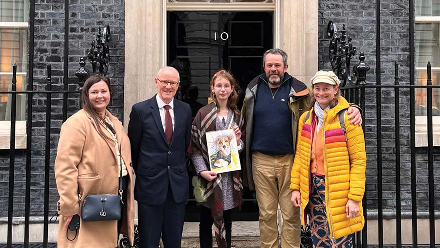 Yaryna, centre, and James Baird, second right, outside 10 Downing St © Yaryna Zakaliuzhna and James Baird