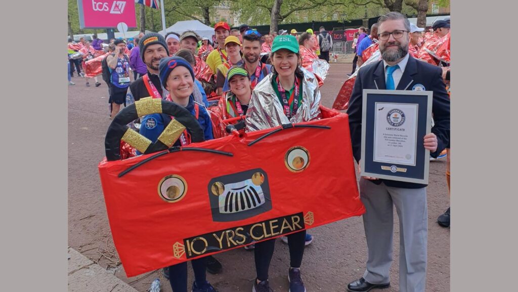 Dan Smith and the red bus team have their Guinness World Record bid certified at the London Marathon
