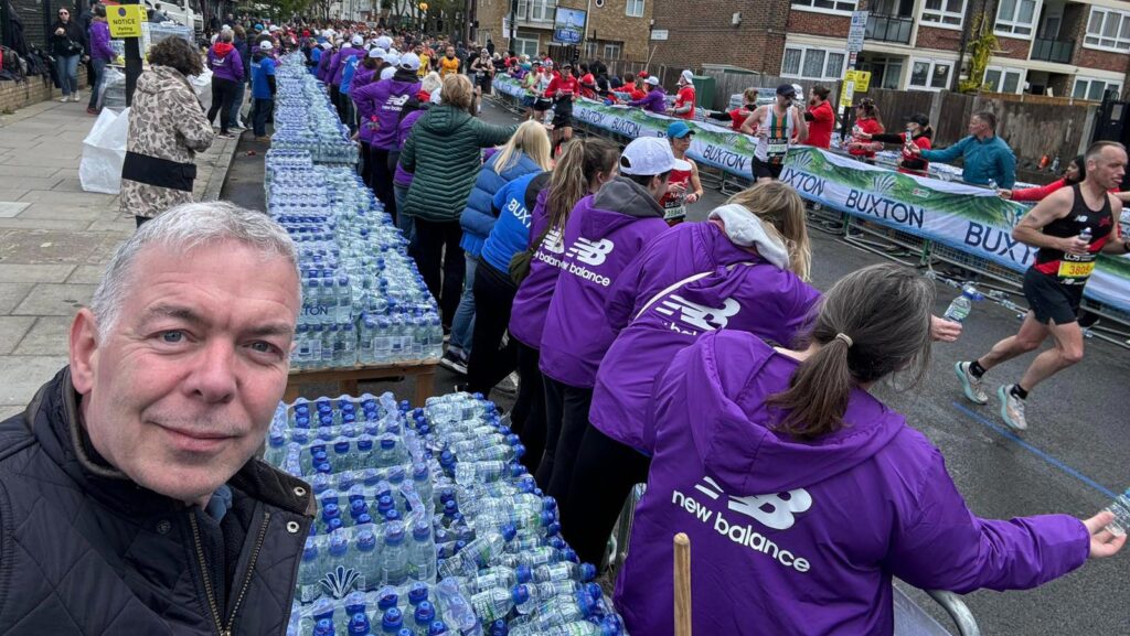 Johann Tasker handing out water at the London Marathon