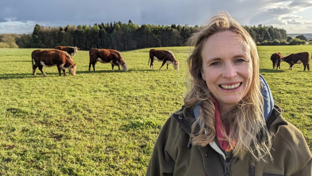 Laura Elliot in field with beef animals