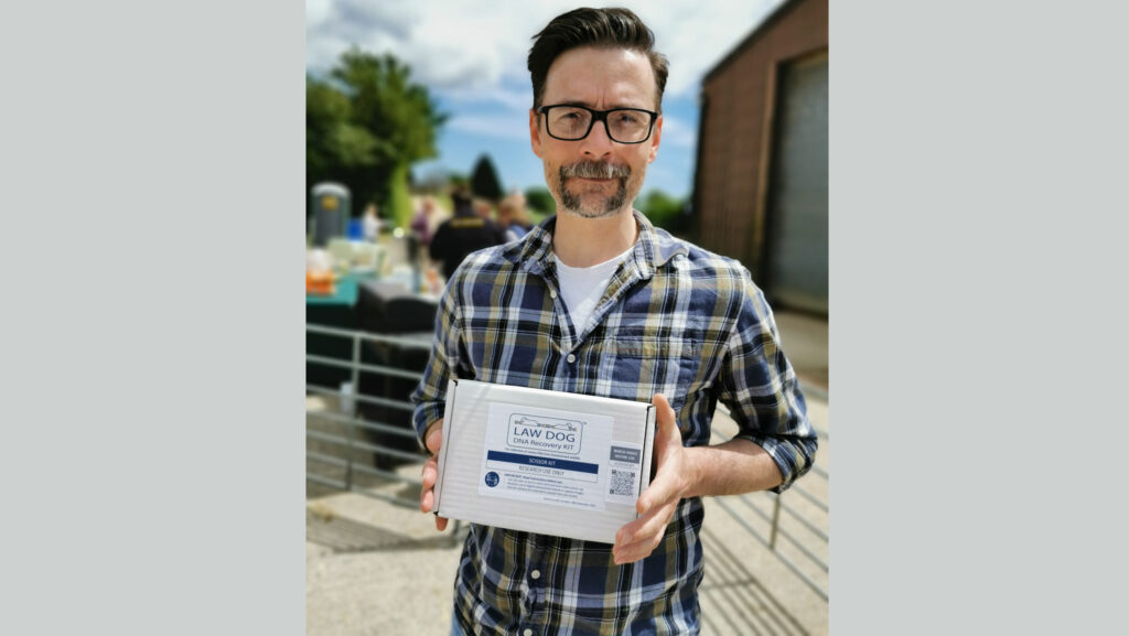 Nick Dawnay holding an early evidence test kit