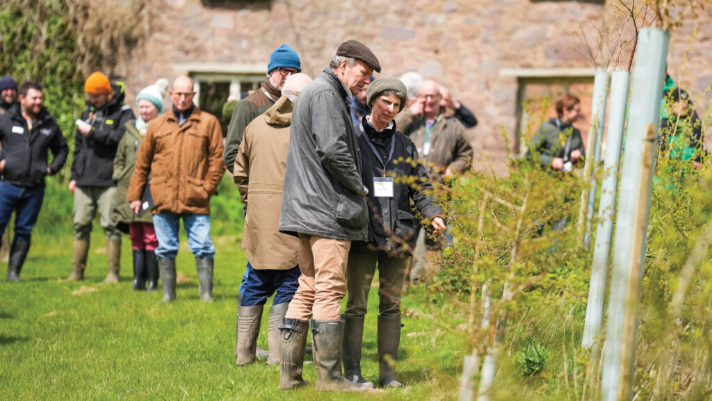 People gathered in the countryside for an event