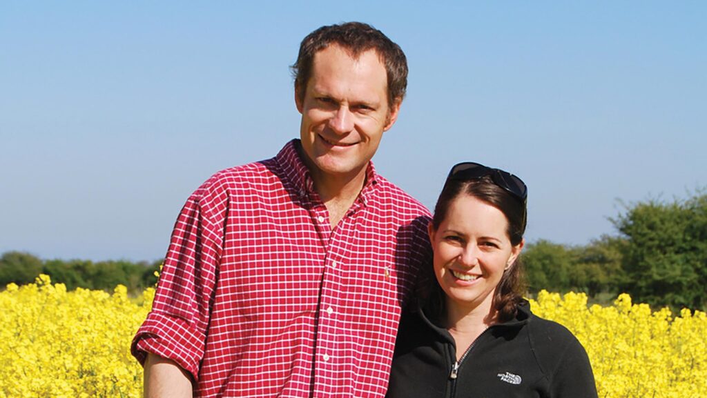 Couple in a field with flowering OSR