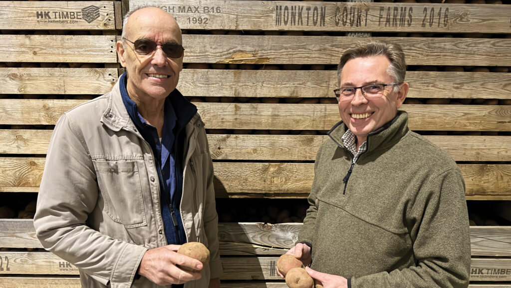 Philip Smith and Graeme Skinner holding potatoes