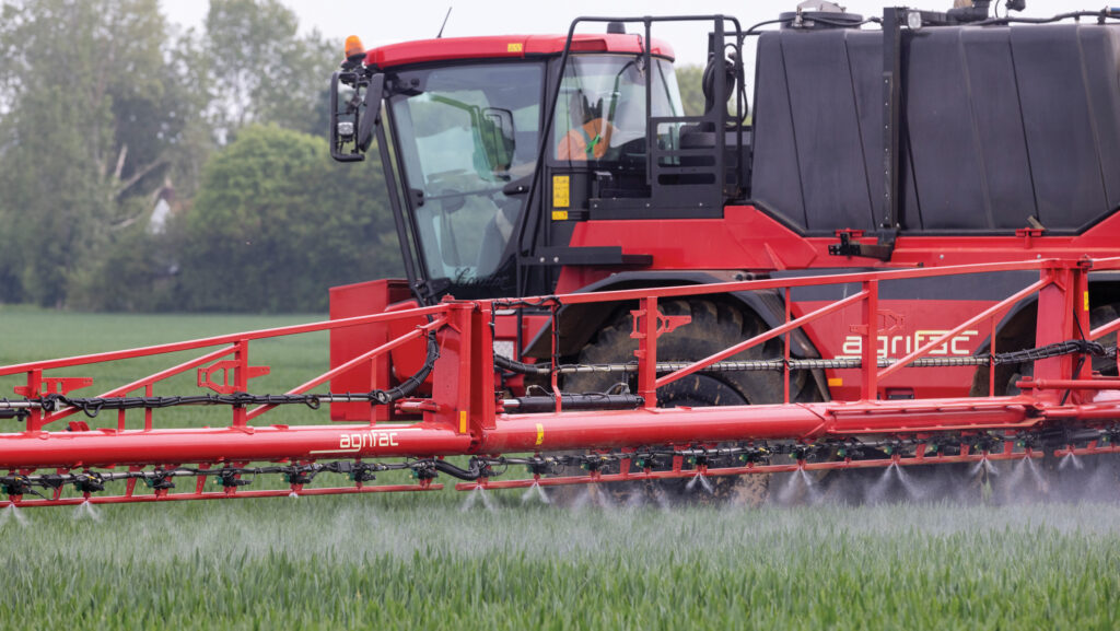 Sprayer operating in a field of winter wheat at T2 timing