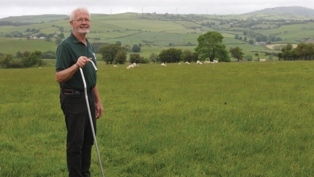 Welsh sheep farmer Elfyn Owen in a field