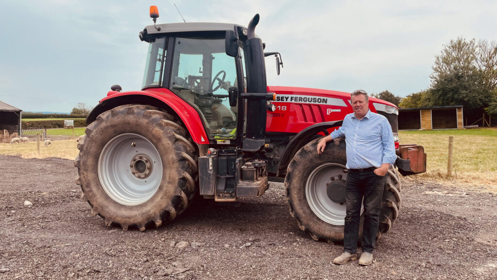 Mark Spencer beside tractor