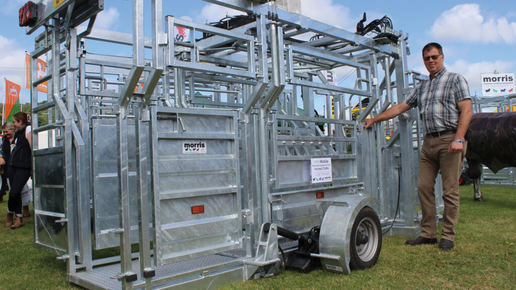 Pete Jones with a Morris Mini Mobile hydraulic crush for horned cattle at the Royal Welsh Show