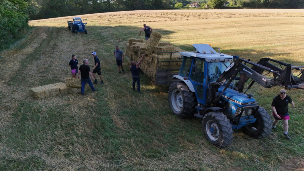 Hay bales loaded onto a tractor