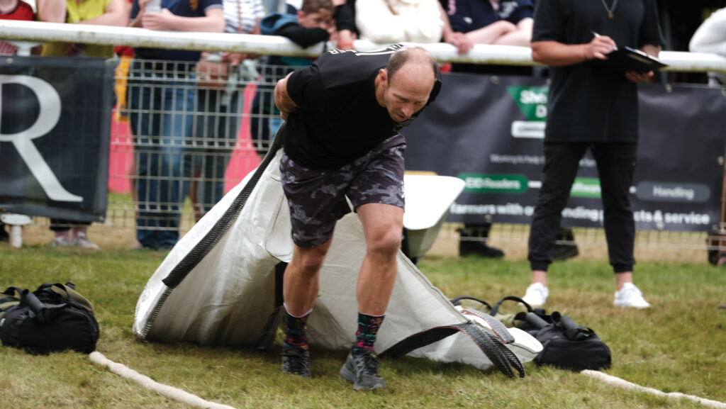 Ed Holmes pulling a weighted sack