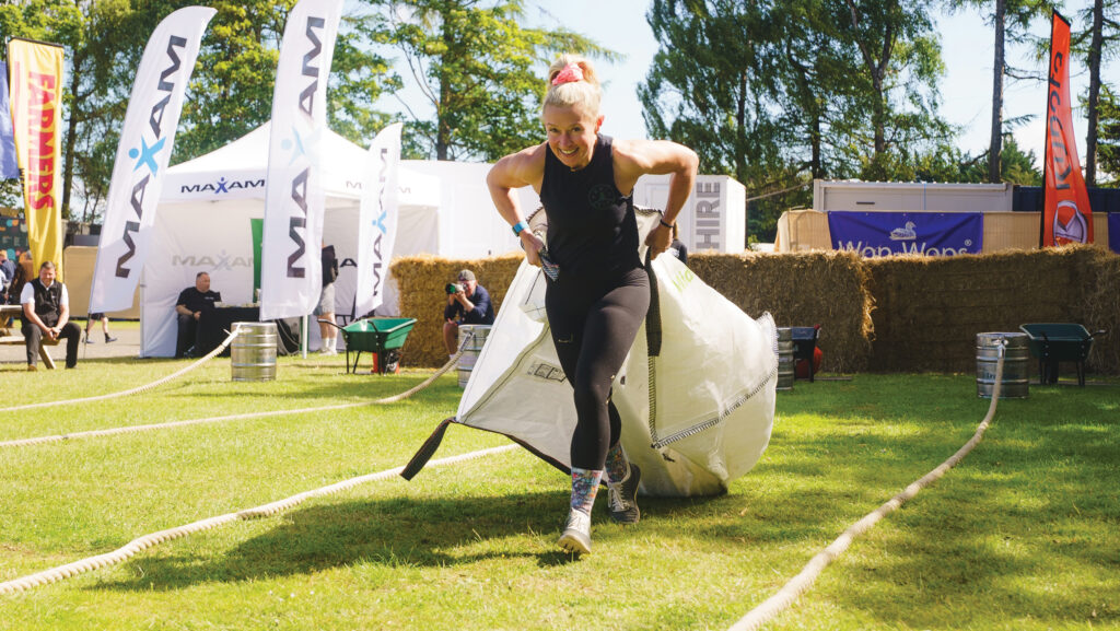 Emma Forster pulling a weighted sack