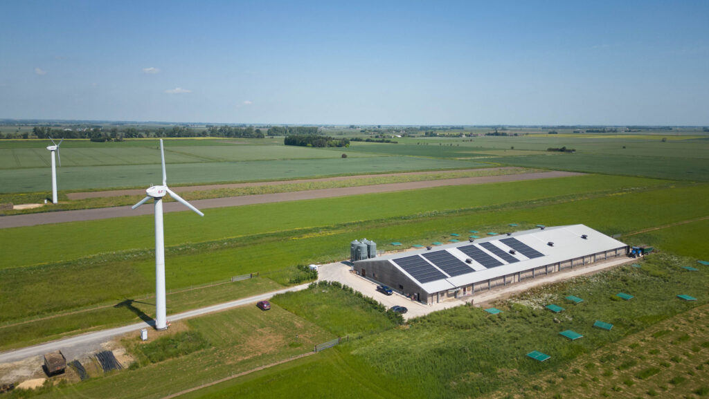 Farm with wind turbines and solar panels