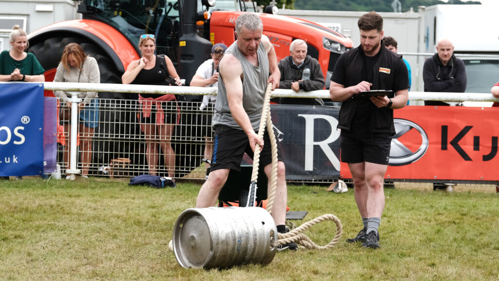 Glenn Pude pulling a barrel towards himself