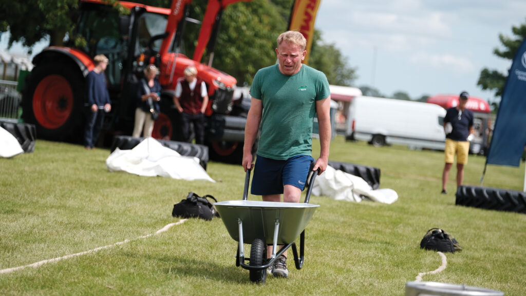 James Hopperton pushing a wheelbarrow