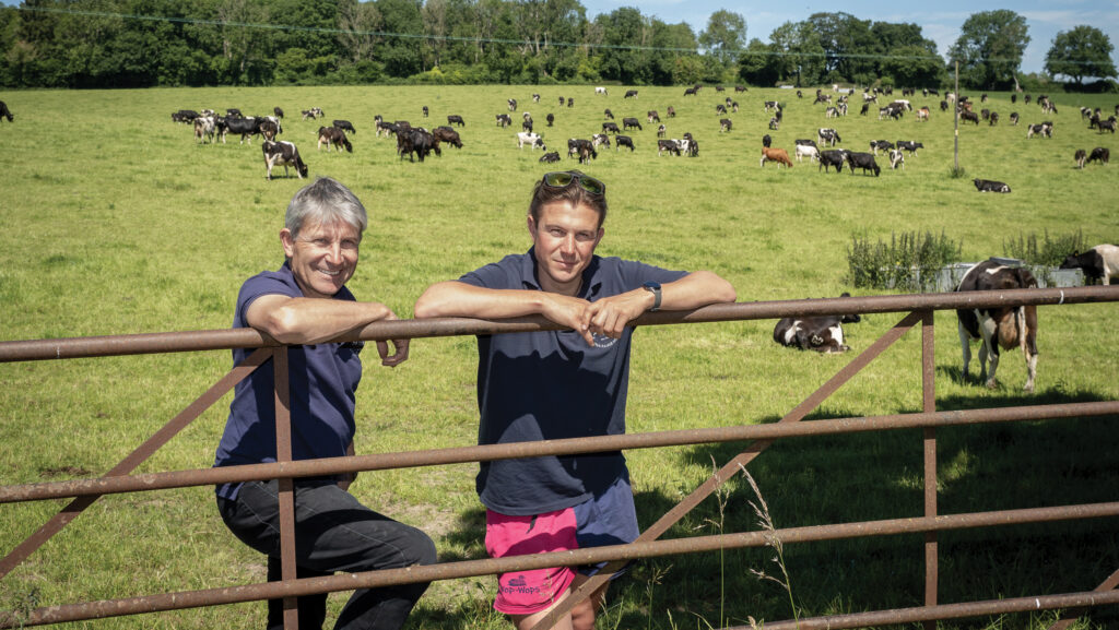 Simon and John Martin leaning on a gate