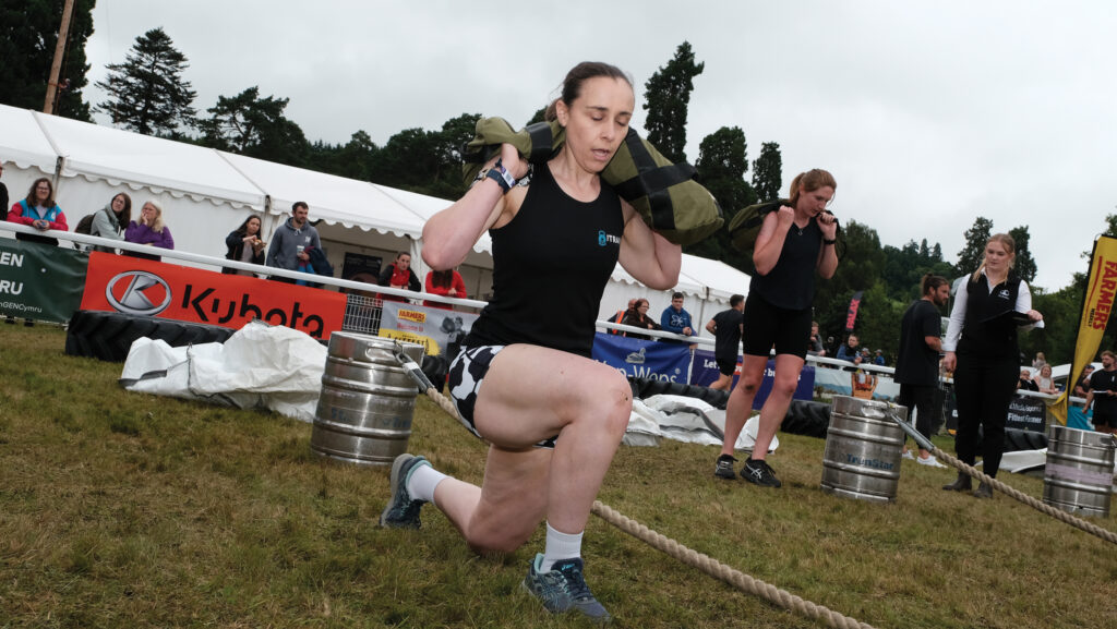 Liz Harries performing lunges with a weighted bag