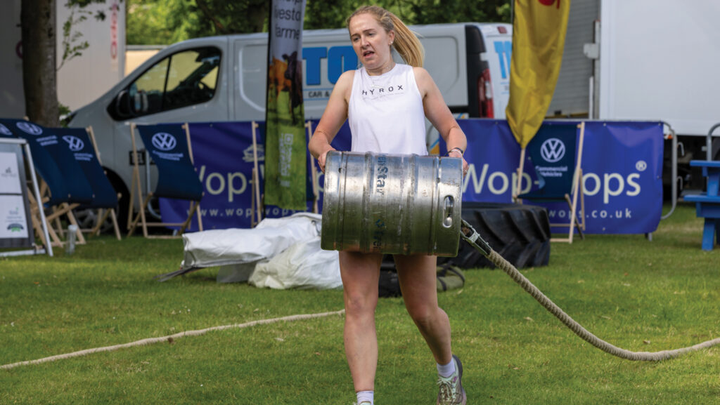 Louise Reade carrying a barrel