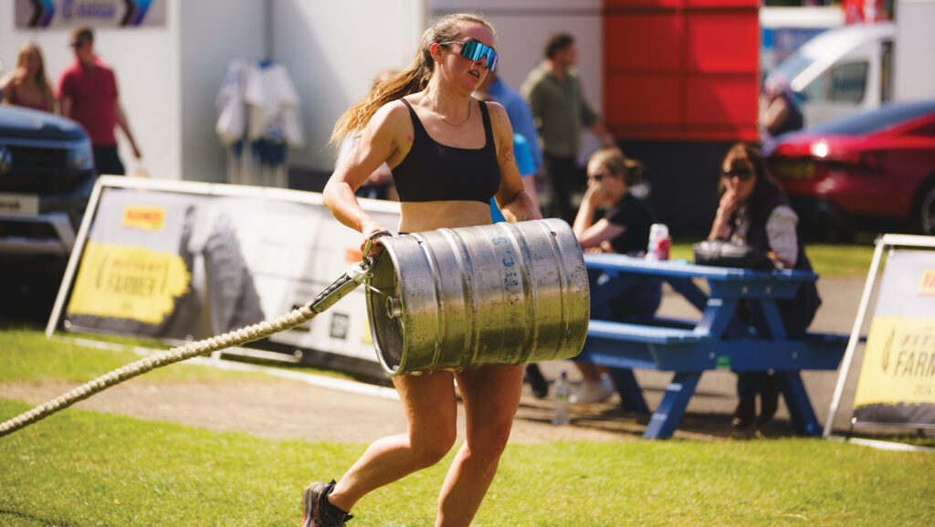 Sarah Gregory carrying a barrel