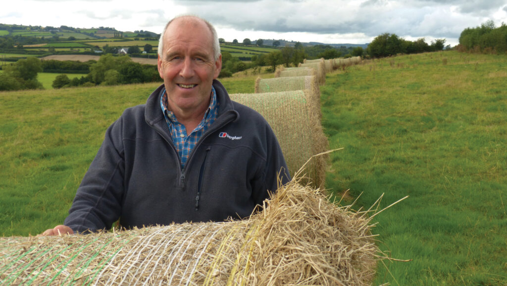 Richard Roderick with bales of grazing 