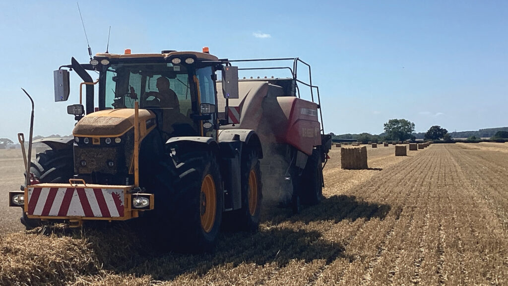 Tractor pulling a baler