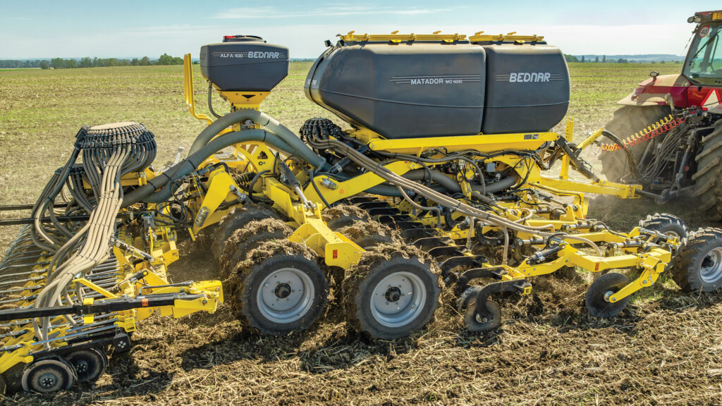 Side view of drill in a field