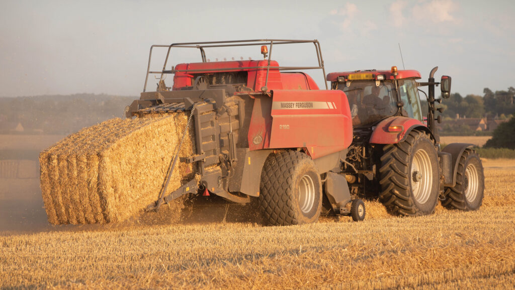 Contractors baling wheat